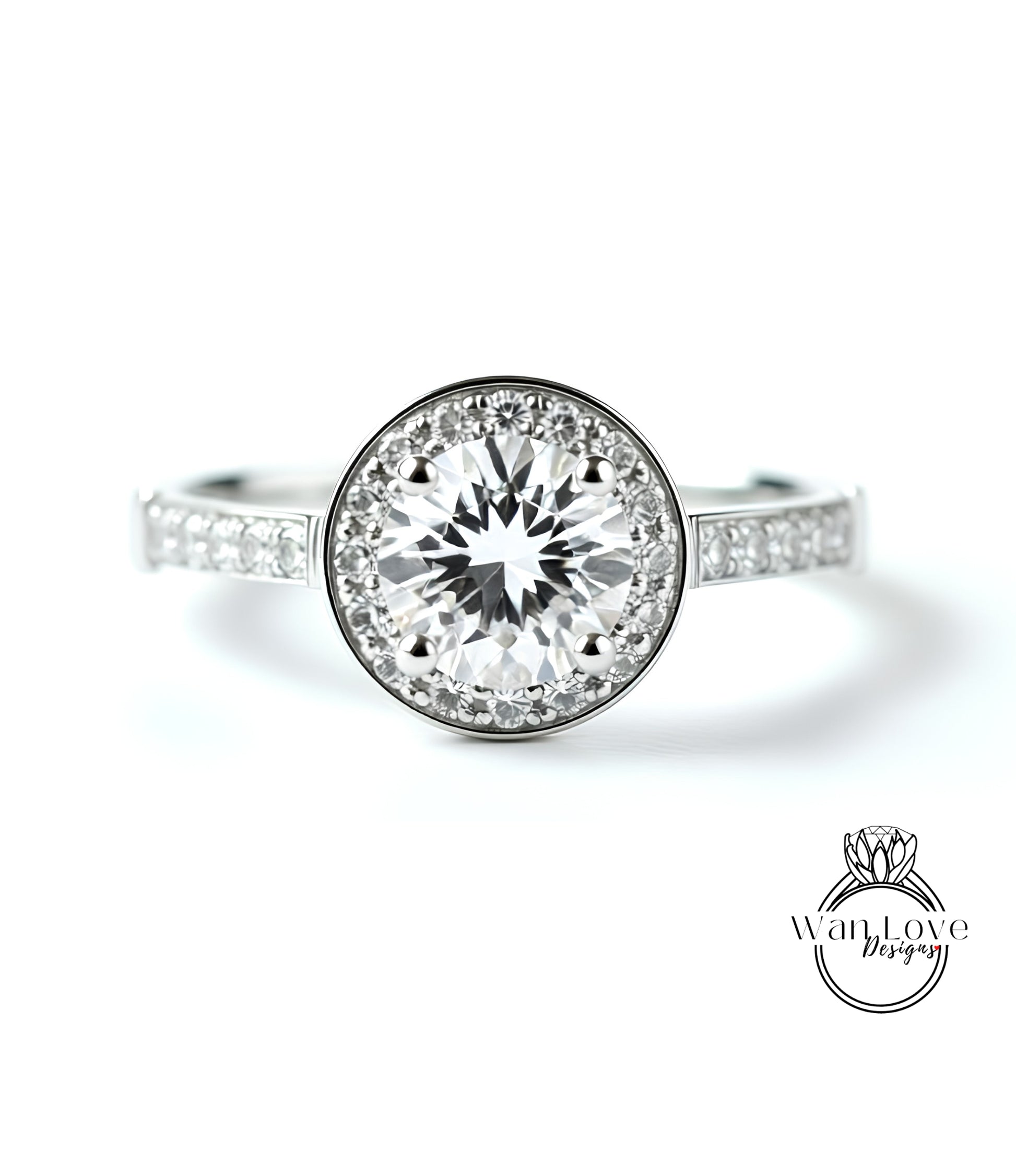 A close-up view of a diamond engagement ring with a large central diamond surrounded by smaller diamonds set in a halo.