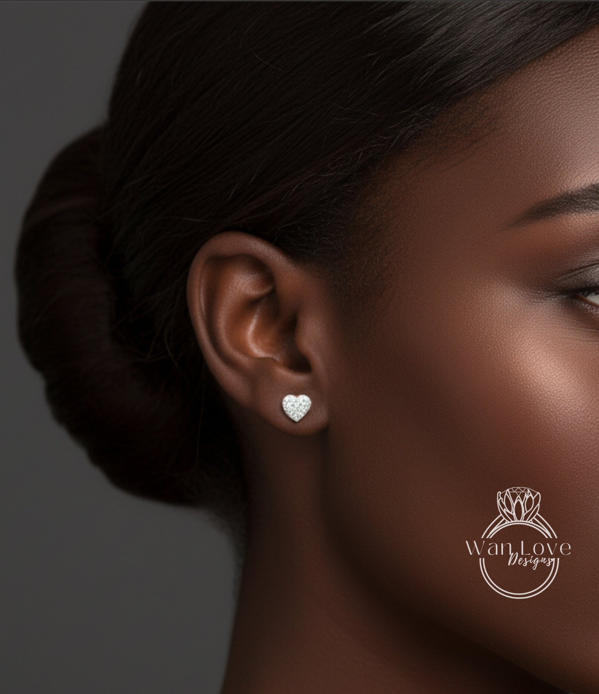A close-up of a woman's face, focusing on her ear with a heart-shaped earring.