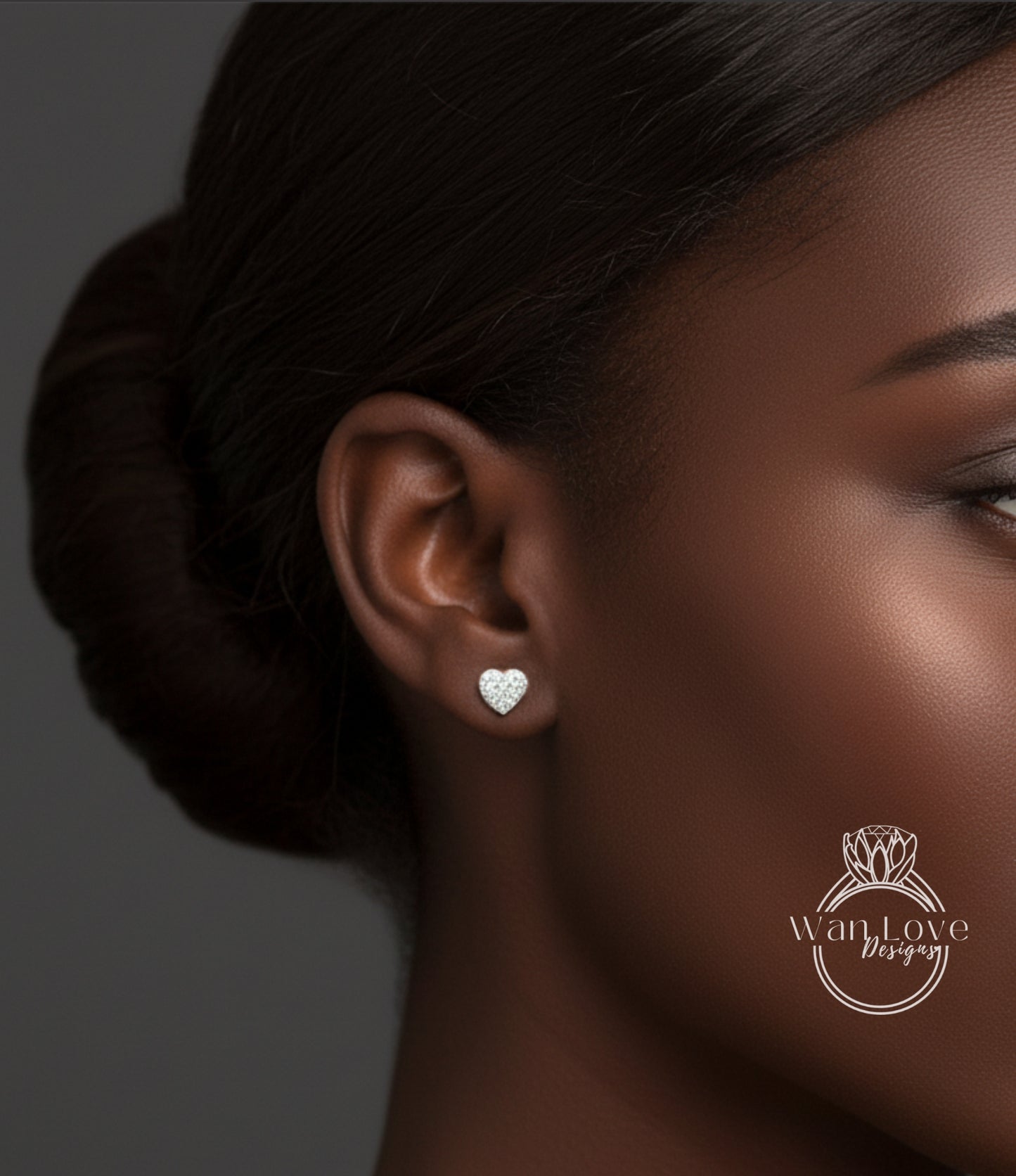 A close-up of a woman's face, focusing on her ear with a heart-shaped earring.