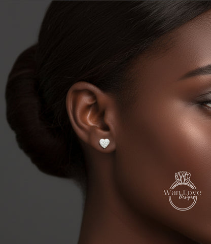 A close-up of a woman's face, focusing on her ear with a heart-shaped earring.