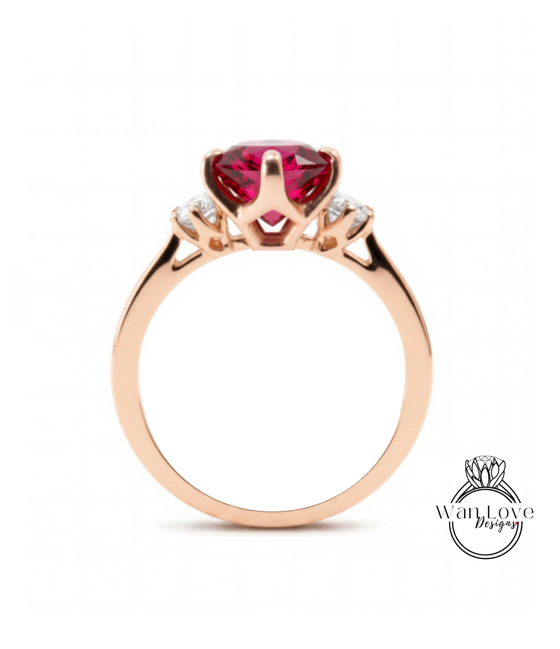 A gold ring with a large, deep red gemstone set in the center.