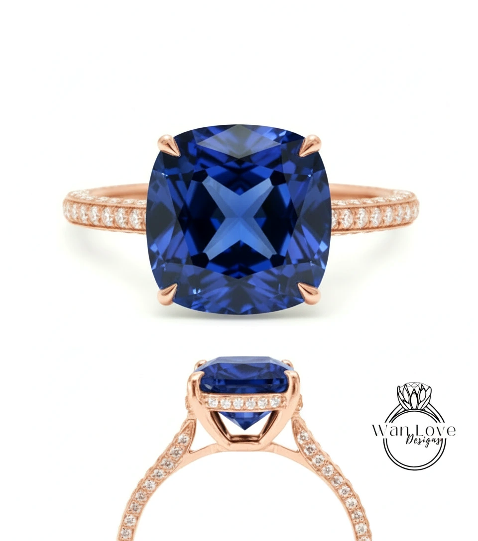 a beautiful blue gemstone ring with a large, square-cut gemstone set in a rose gold band.