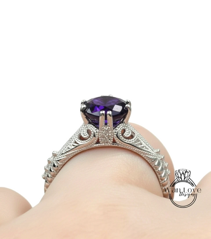 A close-up view of a silver engagement ring with a large purple gemstone, showcasing the intricate design and craftsmanship.