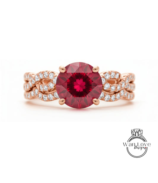 A beautiful engagement ring with a large, deep red gemstone surrounded by a delicate, intricate design of small diamonds set in a rose gold band.
