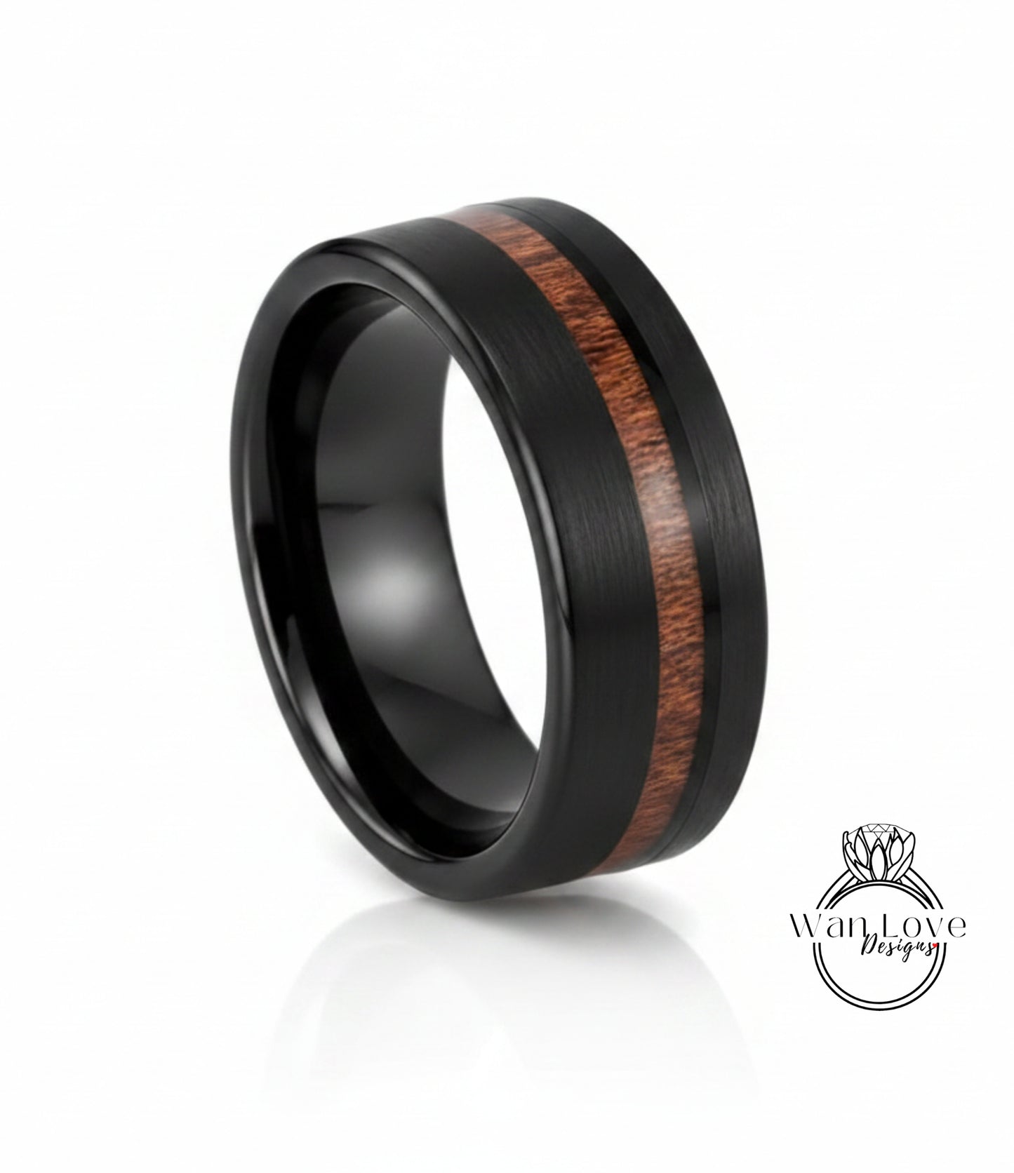 A black ring with a wood grain band in the center, showcasing a unique design.