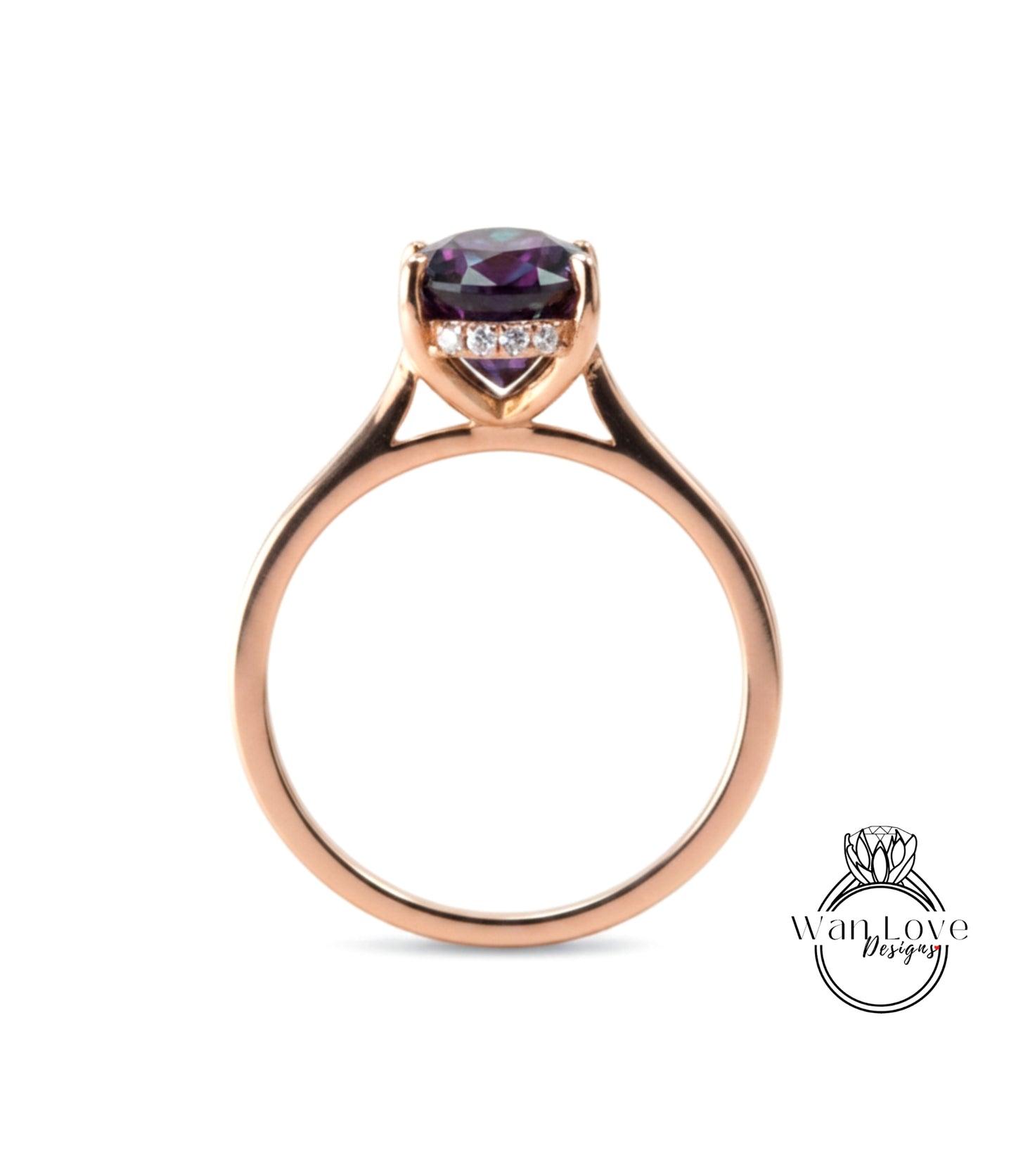 A gold ring with a large purple gemstone set in the center.