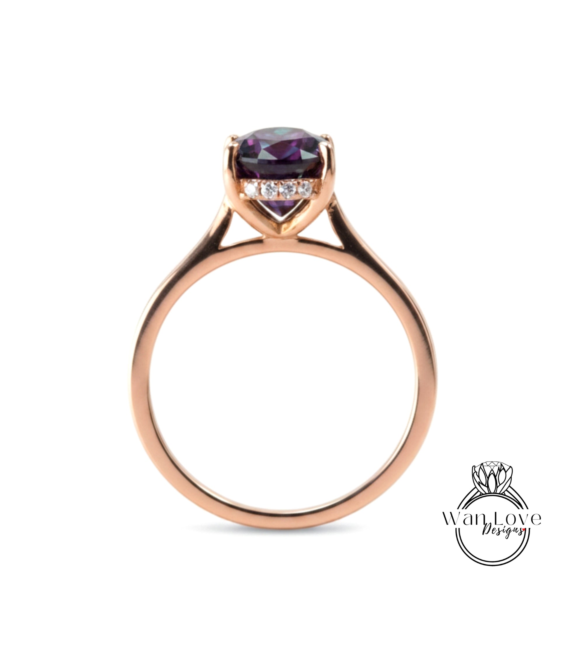 A gold ring with a large purple gemstone set in the center.