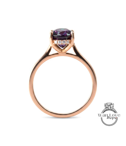 A gold ring with a large purple gemstone set in the center.