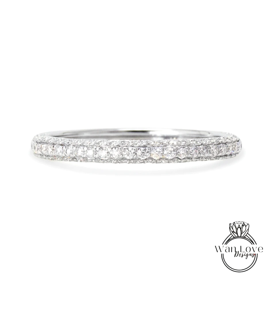 A diamond band ring with a row of small diamonds set in a silver band.