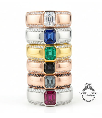 A stack of rings with various gemstones on them, including diamonds and colored gemstones.
