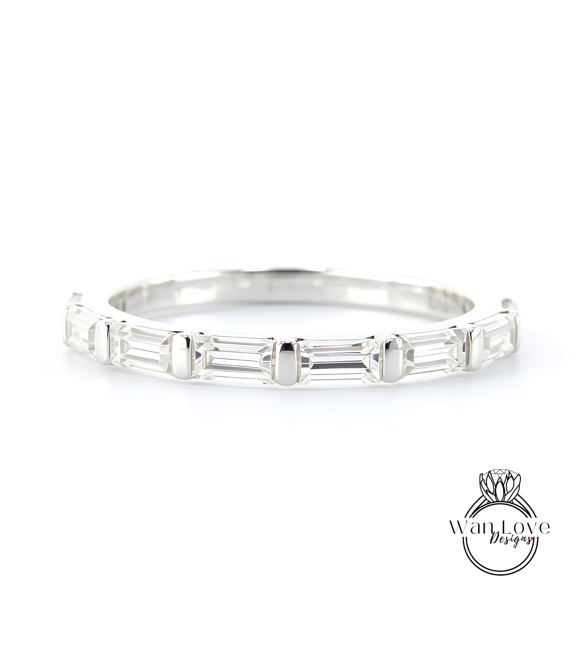 A silver band with a row of clear gemstones, likely diamonds, set in a simple yet elegant design.
