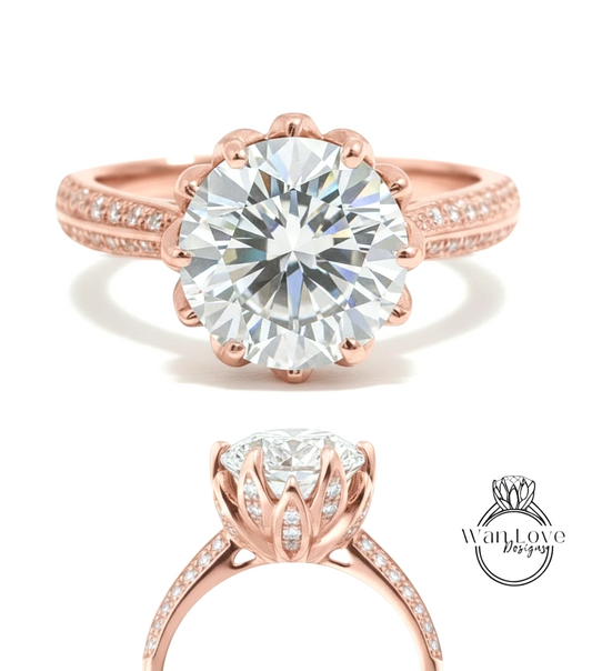 a beautiful rose gold engagement ring with a large, brilliant-cut diamond set in the center. The ring has a scalloped band and is adorned with small diamonds around the band.