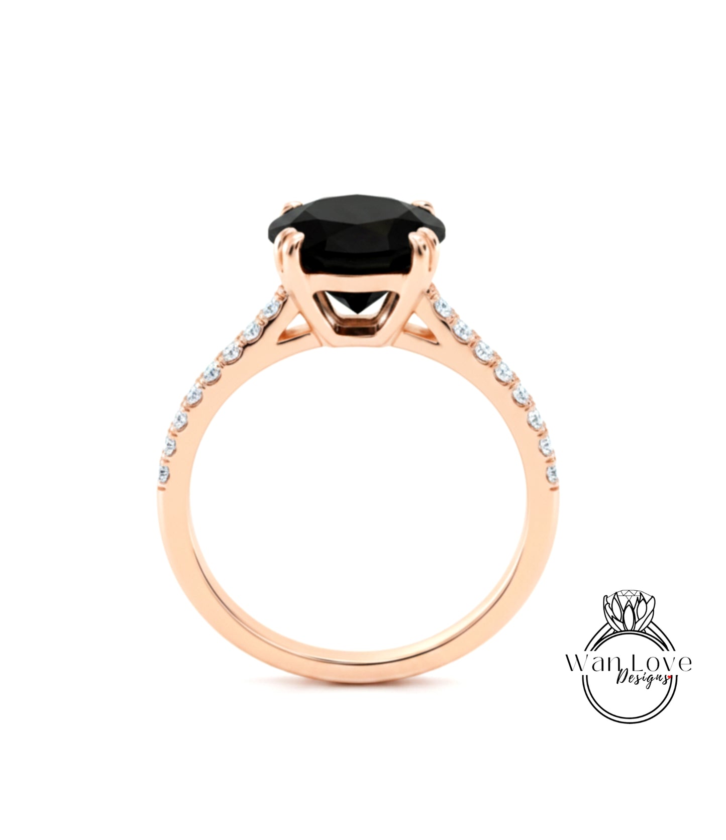 A gold ring with a large black gemstone, likely a diamond, set in the center.
