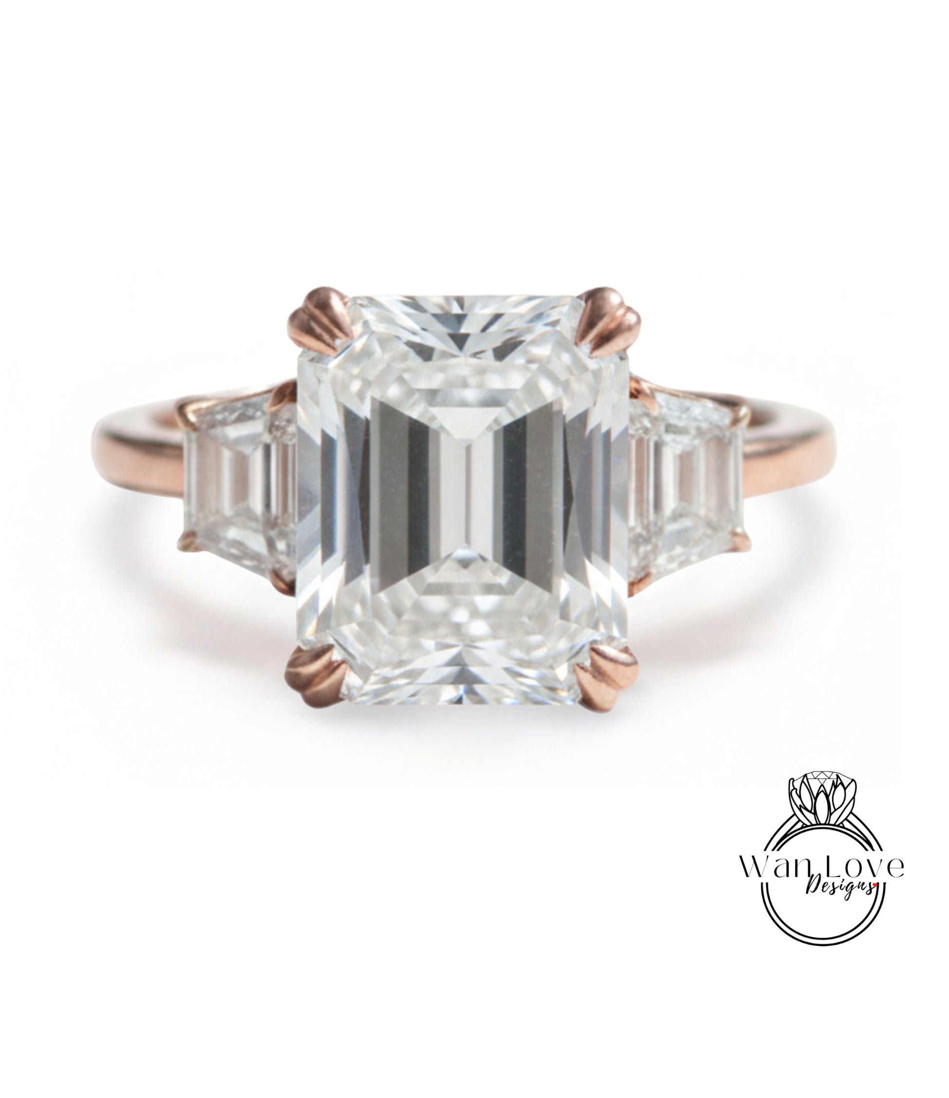 A large, clear gemstone engagement ring with a prominent central diamond surrounded by smaller diamonds on either side.