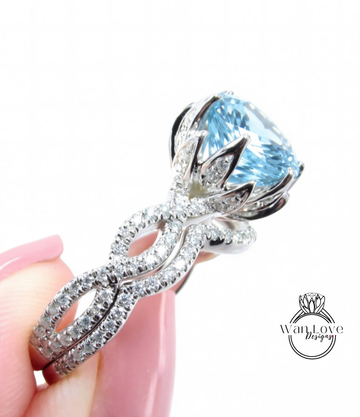 A close-up of a diamond engagement ring being held in a person's hand, showcasing the intricate design and sparkling gemstone.