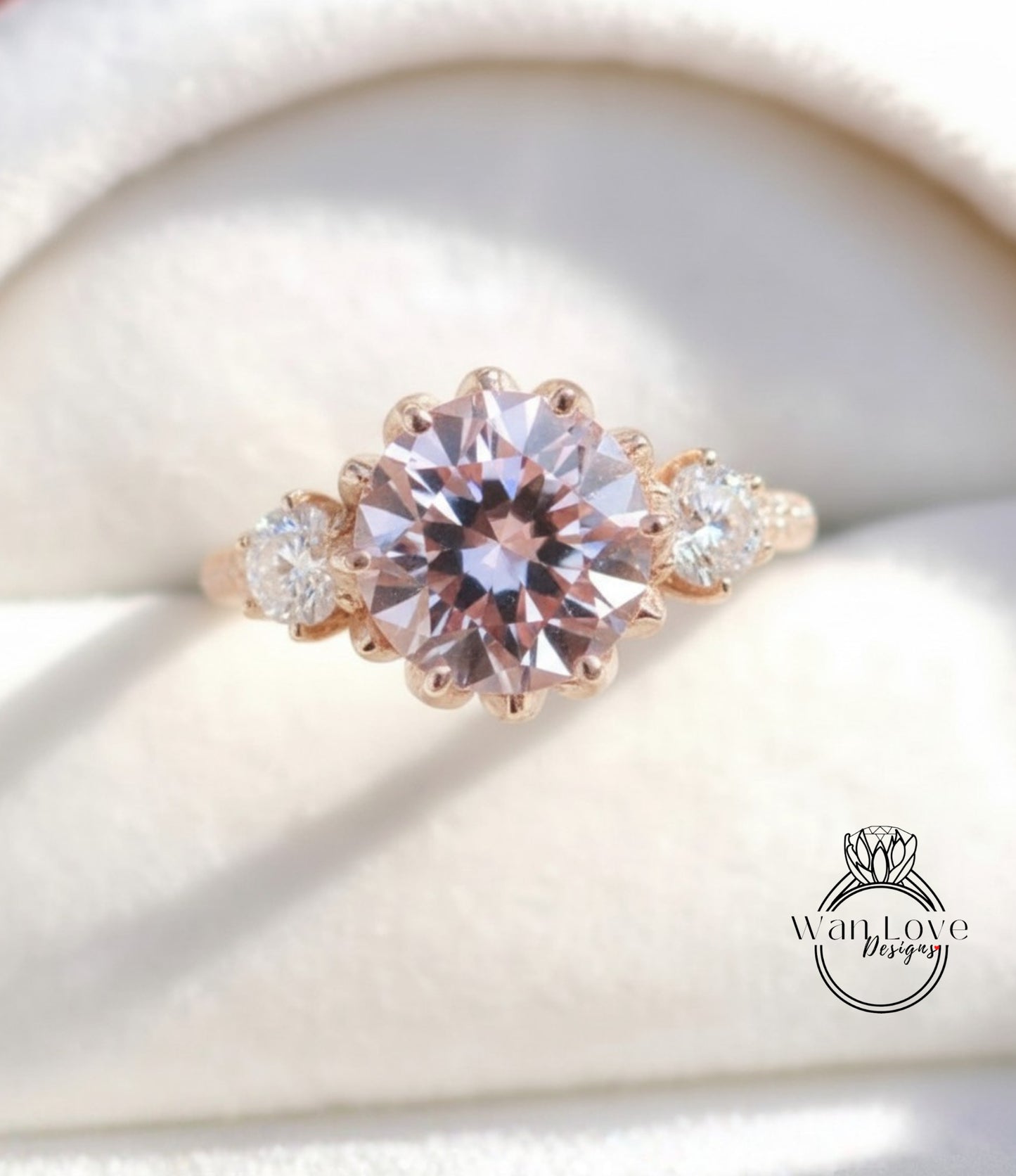 A close-up image of a gold ring with a large, round pink gemstone set in the center, surrounded by smaller diamonds.