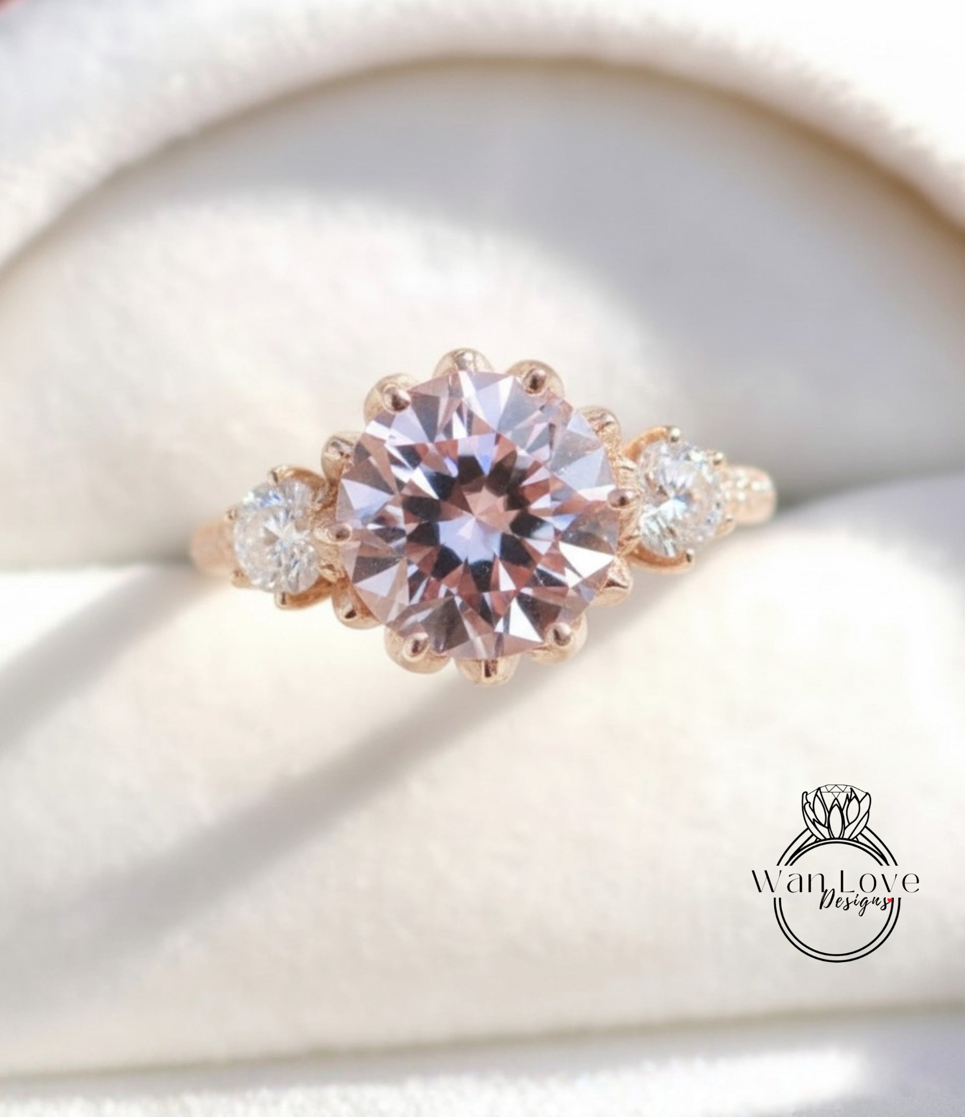 A close-up image of a gold ring with a large, round pink gemstone set in the center, surrounded by smaller diamonds.