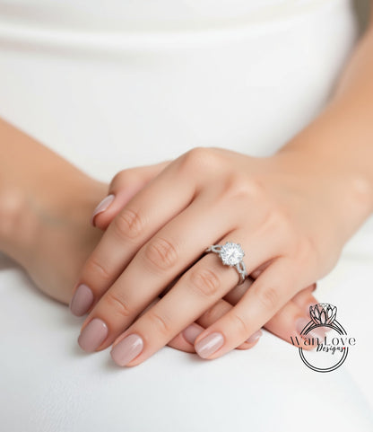 A close-up of a person's hands wearing a diamond engagement ring.