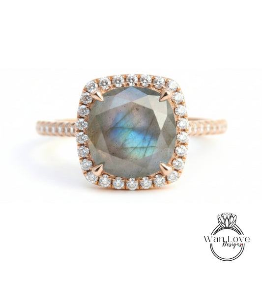 A close-up image of a beautiful engagement ring with a large, square-shaped gemstone surrounded by a halo of smaller diamonds set in a gold band.