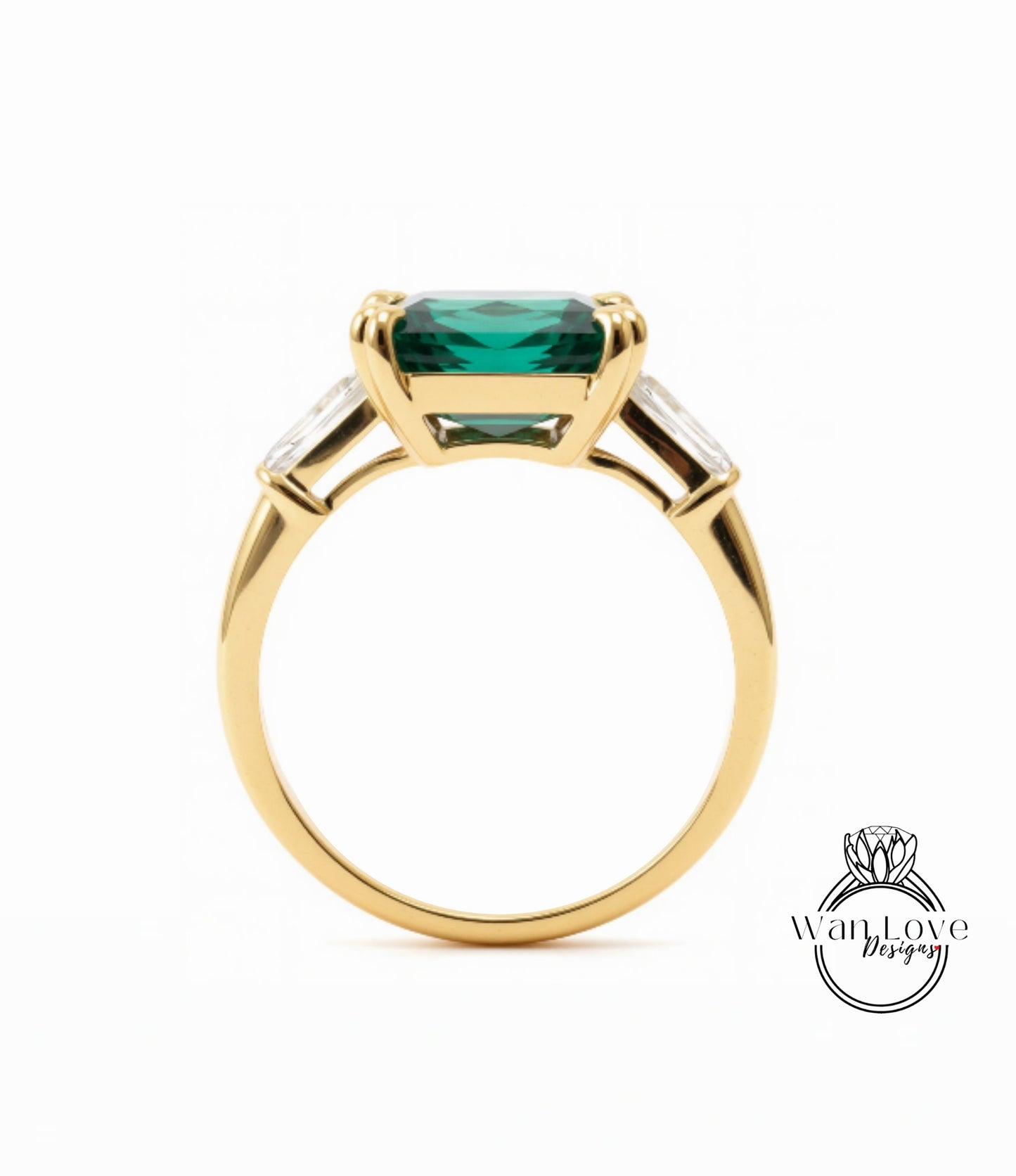A gold ring with a large, green gemstone set in the center.