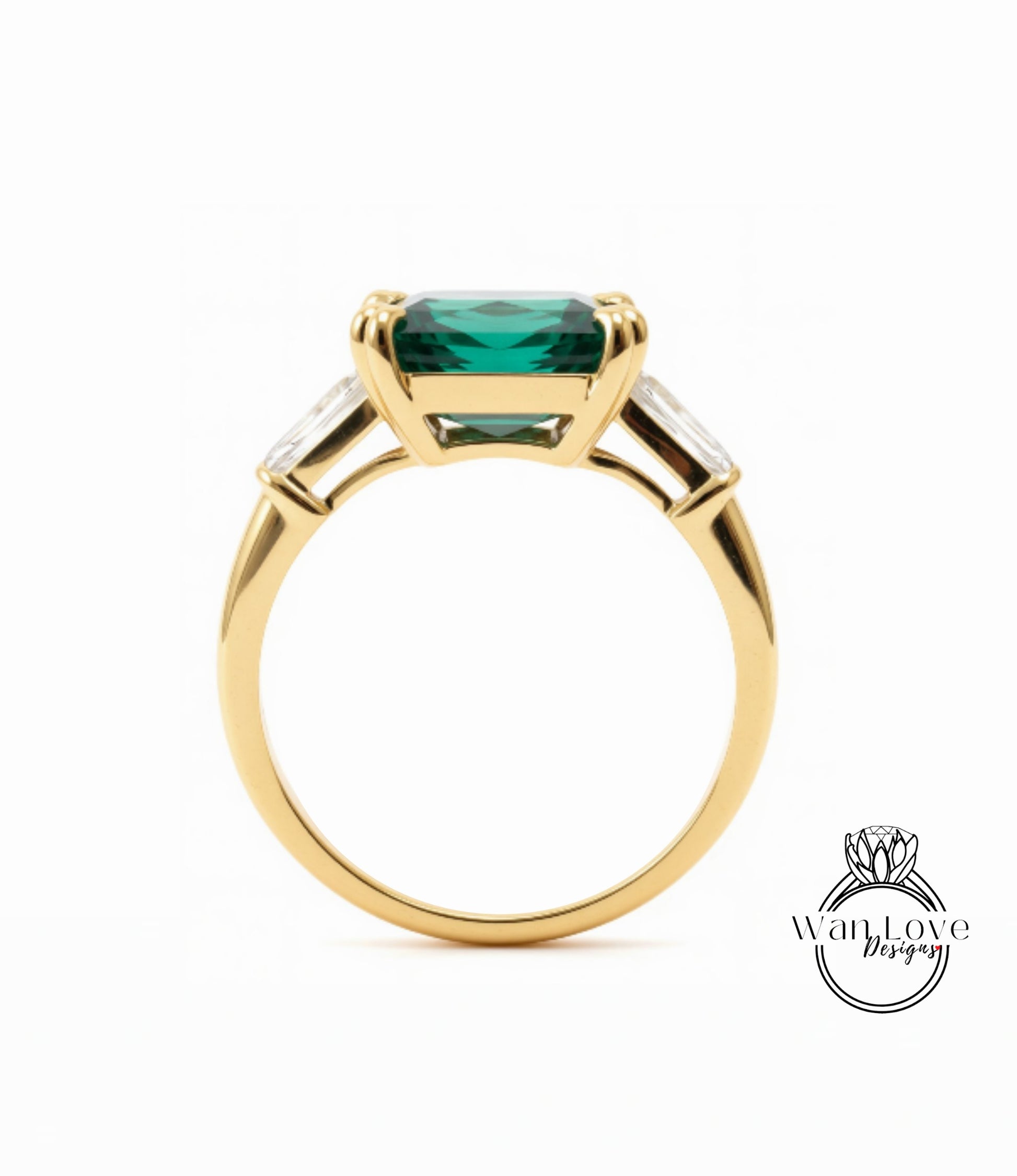 A gold ring with a large, green gemstone set in the center.