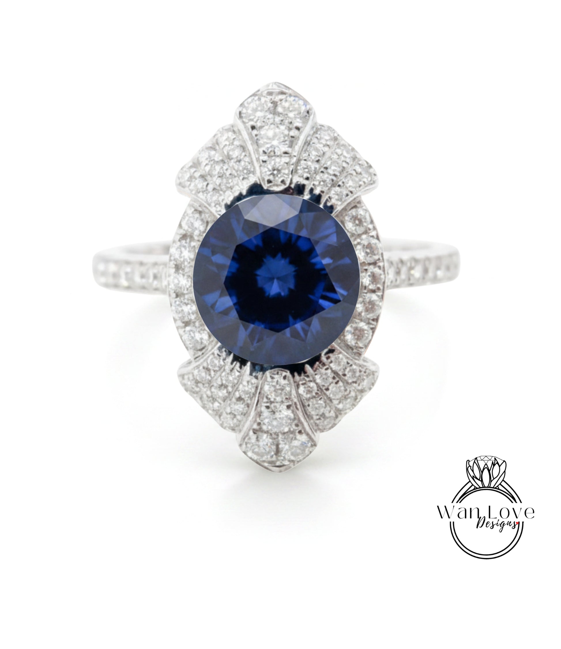 A stunning blue sapphire gemstone set in a silver ring, adorned with numerous sparkling diamonds.