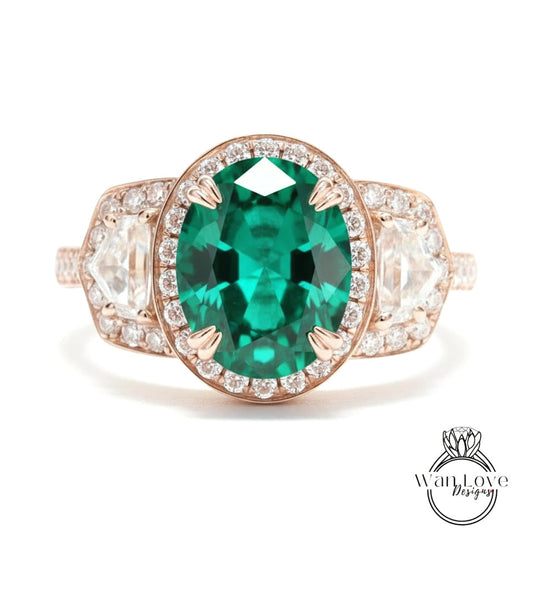A beautiful engagement ring with a large oval-shaped green gemstone surrounded by smaller diamonds set in a rose gold band.