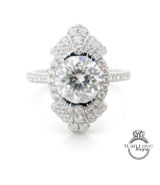 A stunning diamond engagement ring with a large central diamond surrounded by smaller diamonds set in an intricate, fan-like design.