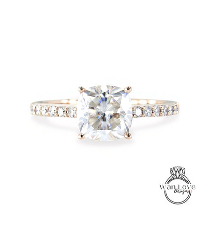 A diamond engagement ring with a large, clear gemstone set in a gold band.