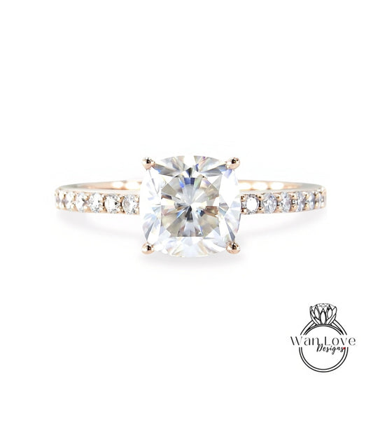A diamond engagement ring with a large, clear gemstone set in a gold band.