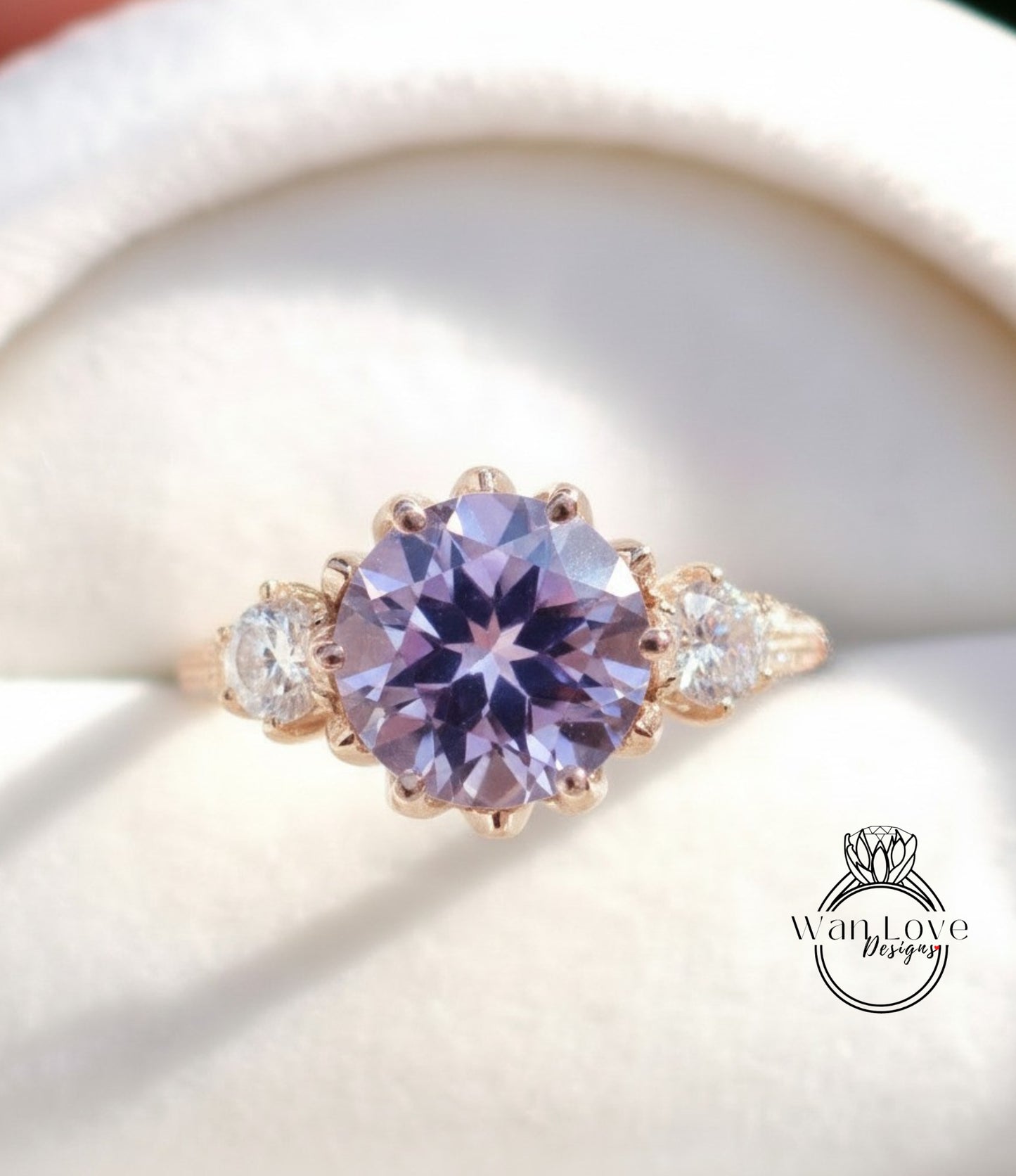 A close-up image of a gold ring with a large purple gemstone, showcasing the intricate details and craftsmanship of the jewelry.