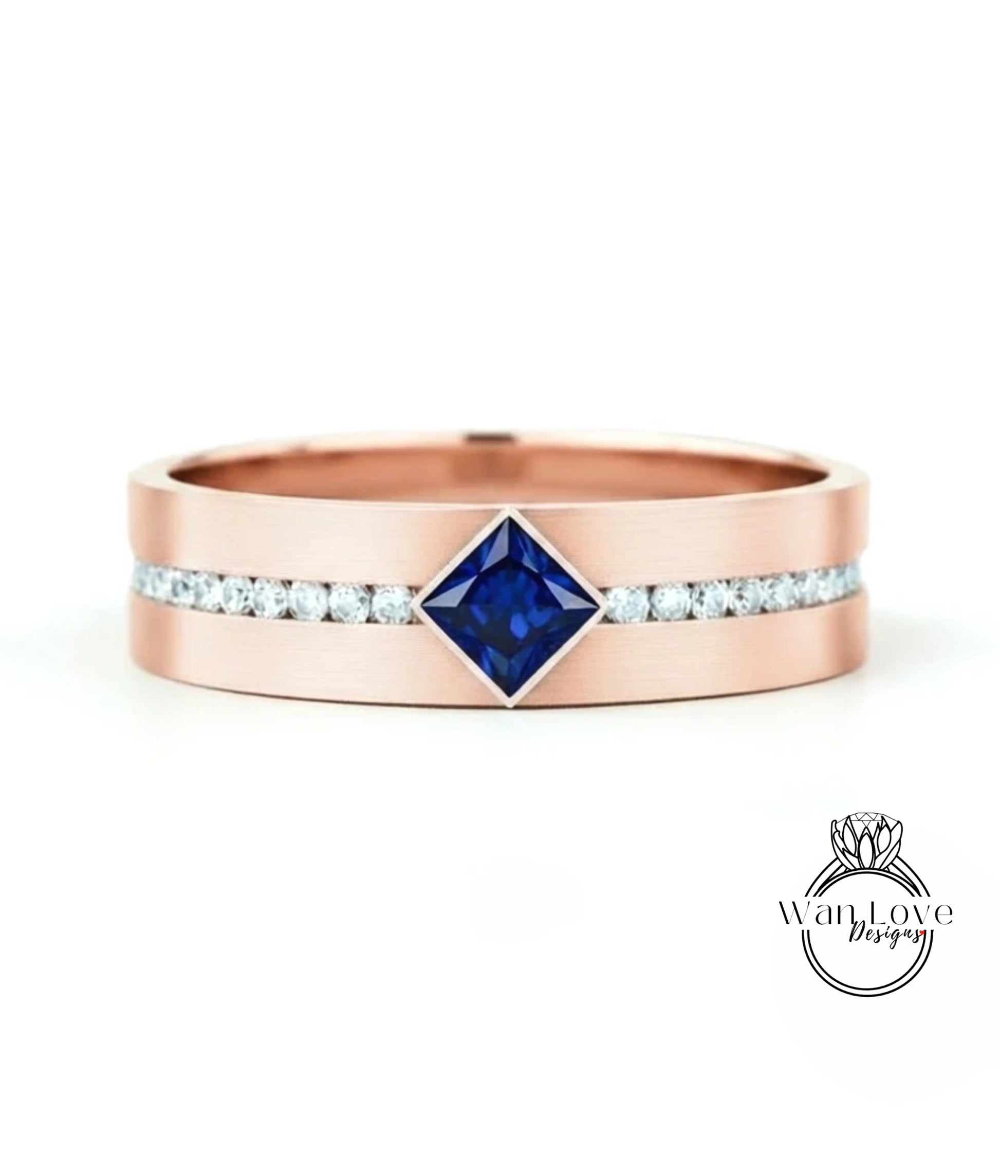 A rose gold ring with a large blue gemstone in the center, surrounded by smaller diamonds.