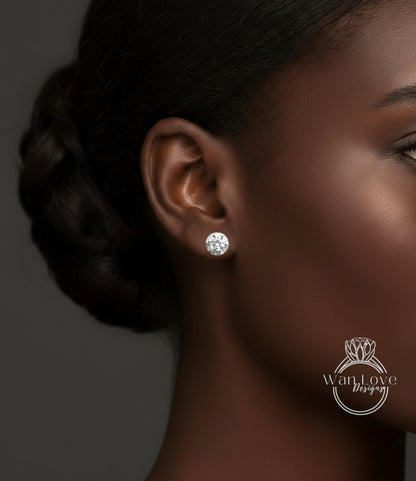 A close-up of a woman's ear with a diamond earring, against a dark background.