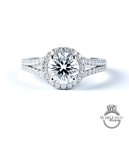A stunning diamond engagement ring with a large central diamond surrounded by smaller diamonds set in a halo of smaller diamonds.
