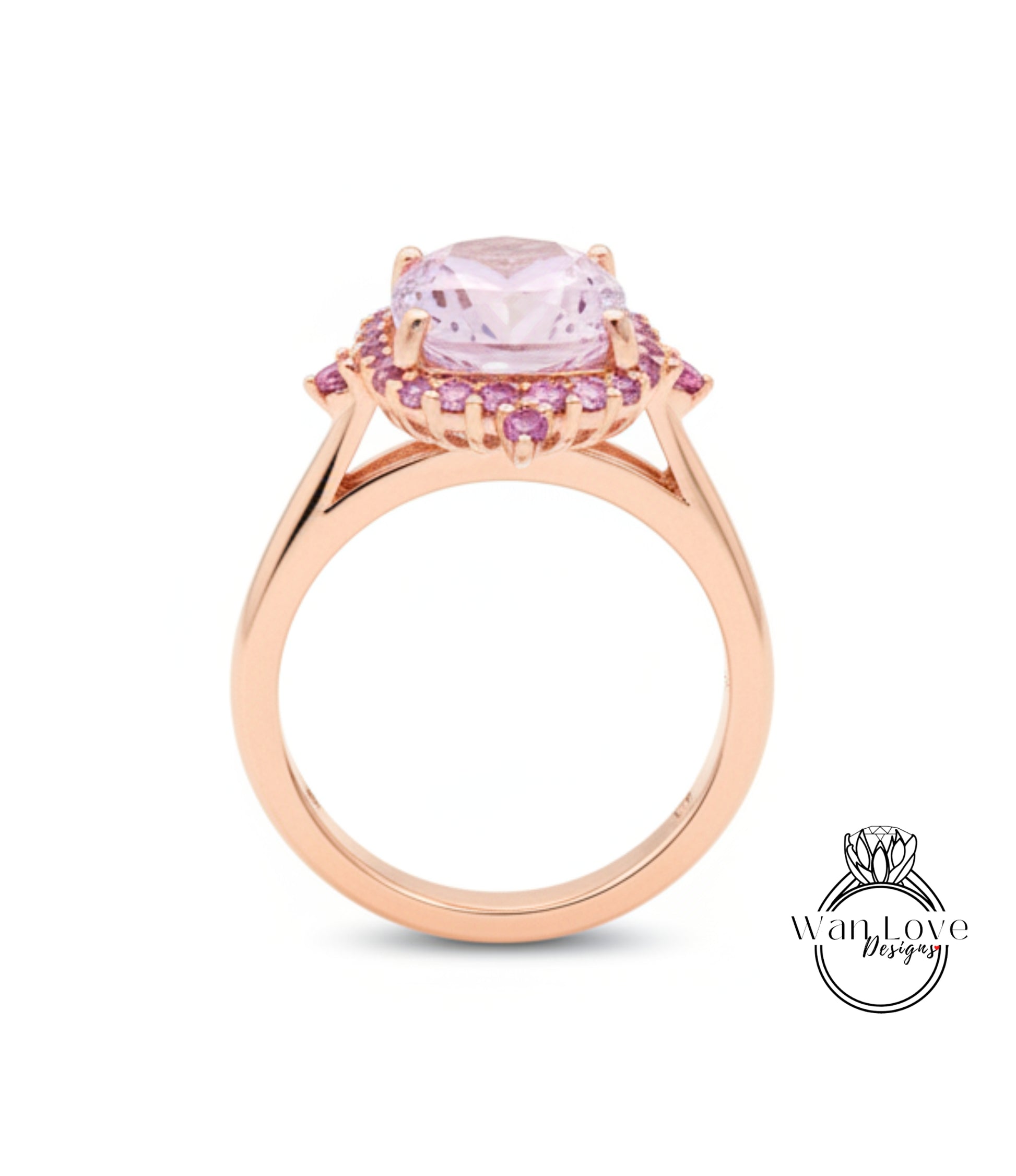 A rose gold ring with a large pink gemstone set in the center, surrounded by smaller pink gemstones.