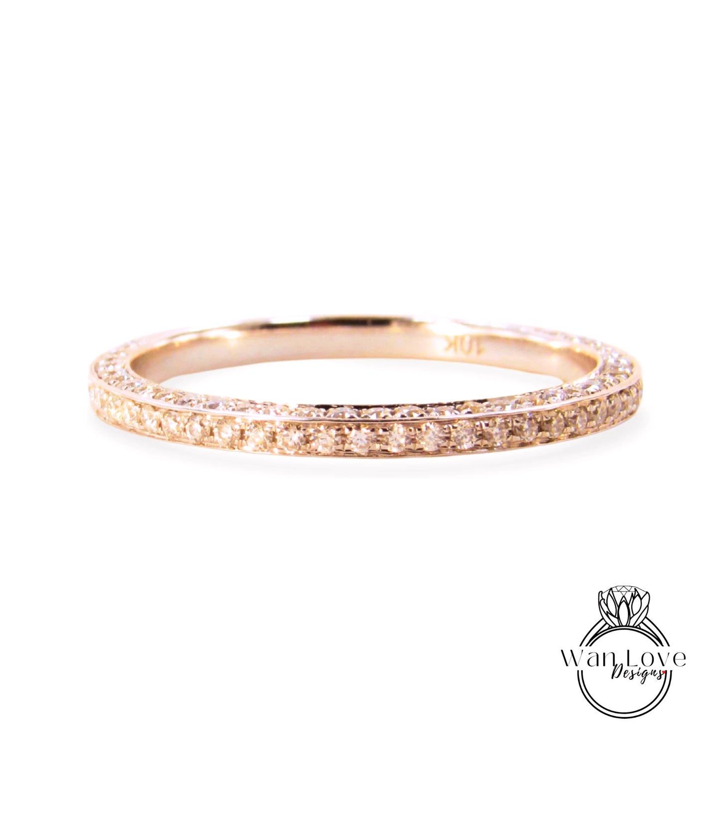 A gold ring with a row of small diamonds along the band.