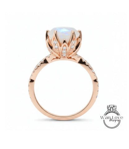 A rose gold engagement ring with a large opal gemstone set in a decorative flower-like design.