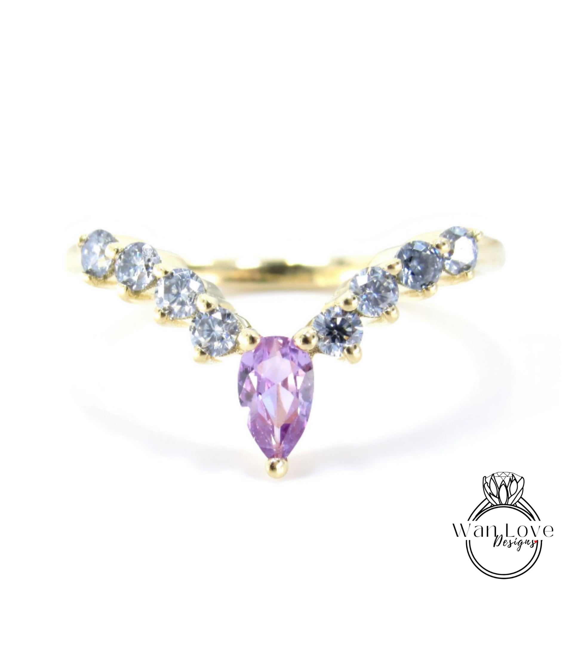 A gold ring with a large purple gemstone in the center, surrounded by smaller blue gemstones.