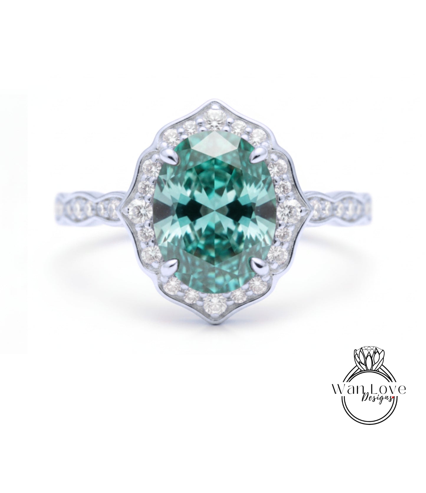 A stunning engagement ring with a large oval-shaped gemstone set in a halo of smaller diamonds, surrounded by a scalloped band.