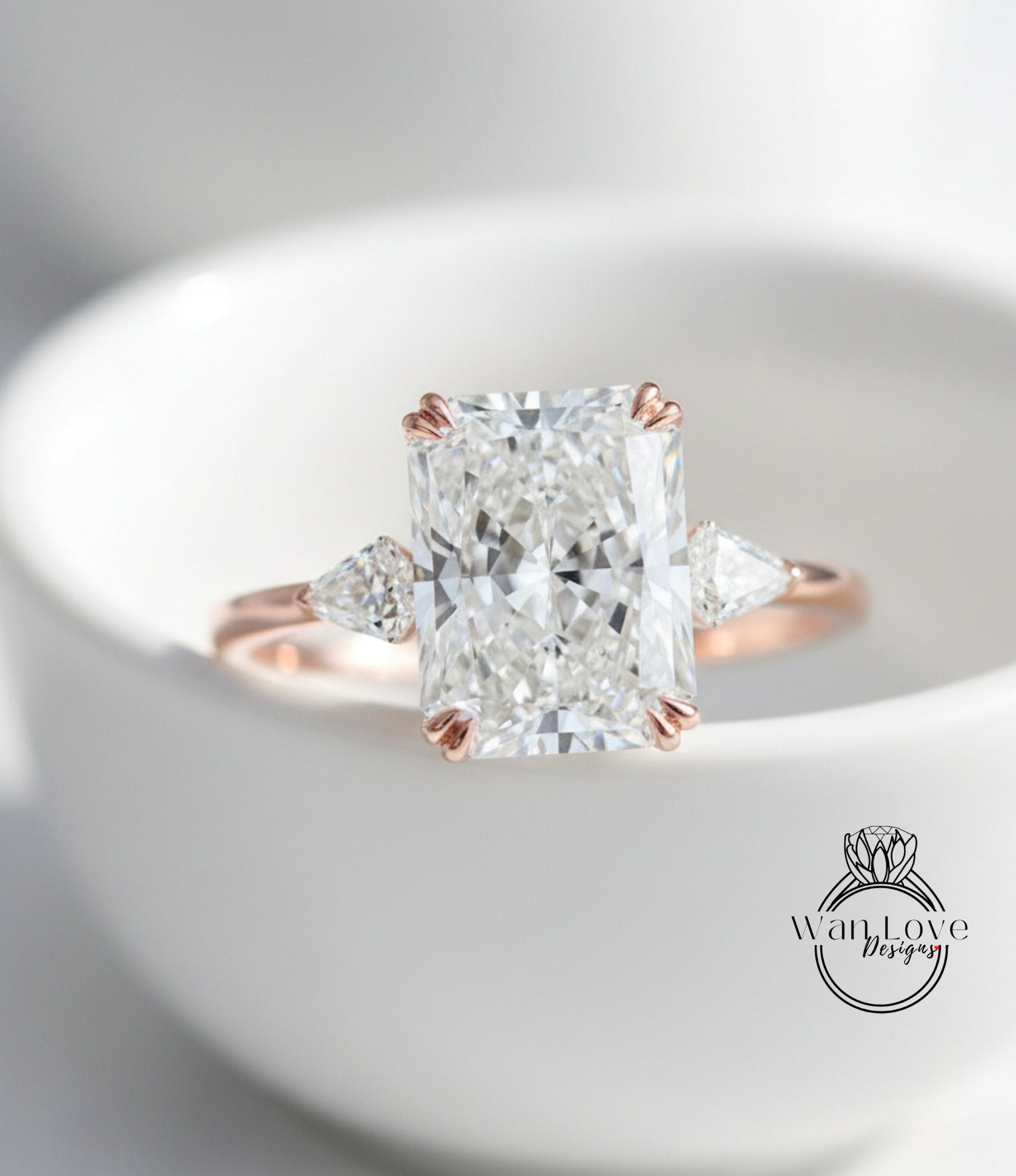 A close-up image of a diamond engagement ring with a large, brilliant-cut diamond set in a rose gold band.