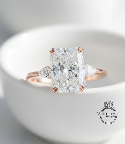 A close-up image of a diamond engagement ring with a large, brilliant-cut diamond set in a rose gold band.