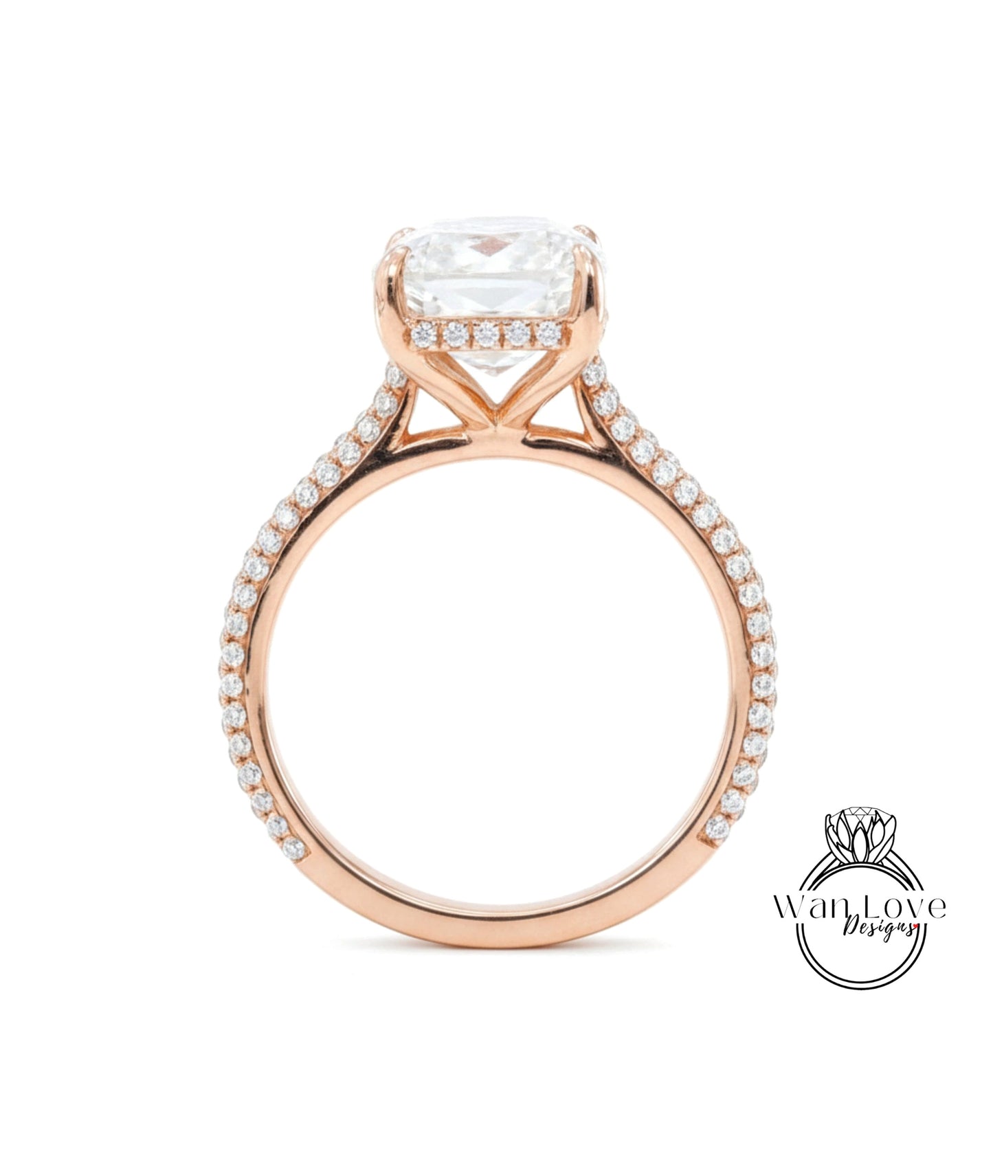 A close-up of a rose gold engagement ring with a large, clear gemstone set in the center.