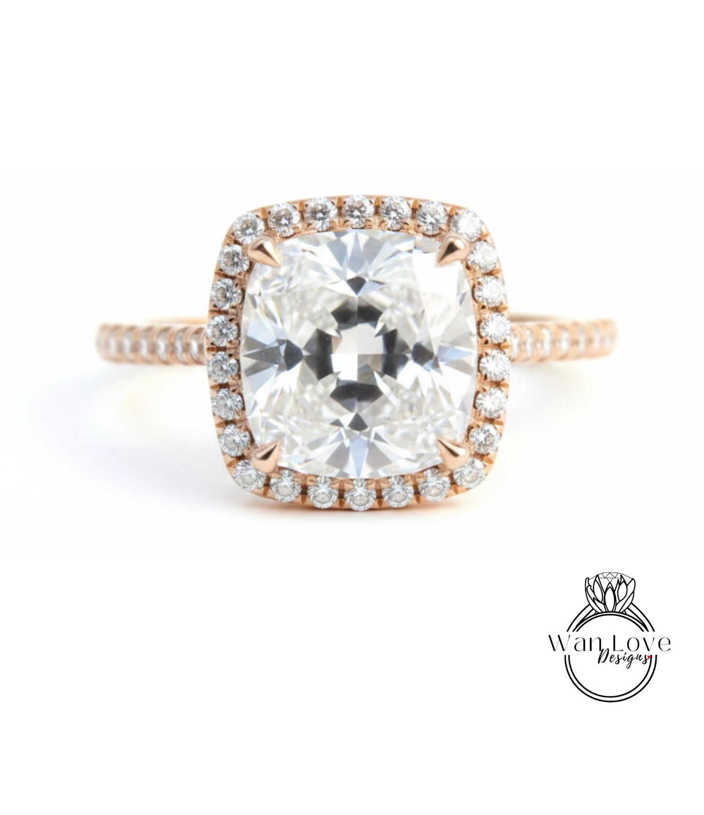 A large, clear diamond engagement ring with a halo of smaller diamonds around the center stone.