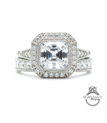 A stunning diamond engagement ring with a large central diamond surrounded by smaller diamonds and set in a halo of smaller diamonds.