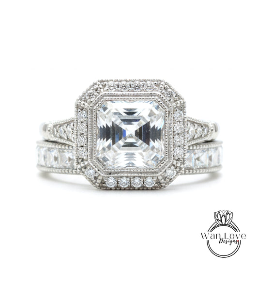 A stunning diamond engagement ring with a large central diamond surrounded by smaller diamonds and set in a halo of smaller diamonds.