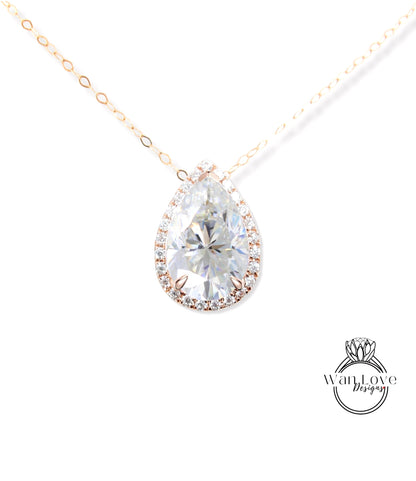 A close-up of a diamond pendant with a large, clear gemstone set in a halo of smaller diamonds, suspended from a gold chain.