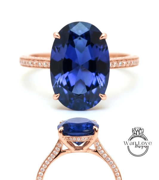 a beautiful blue gemstone ring with a large oval-shaped blue gemstone set in a rose gold band.
