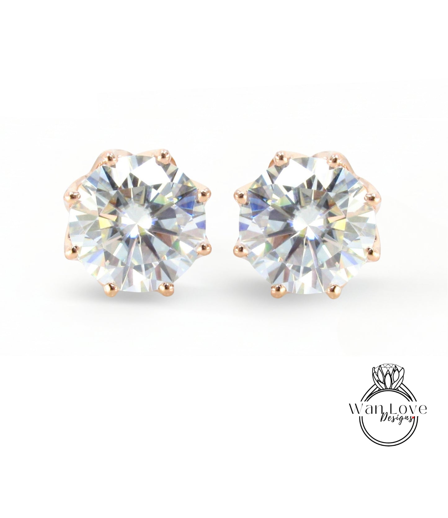 A pair of elegant earrings with large, clear gemstones set in a gold-colored metal.