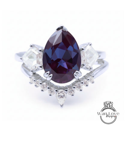 A close-up image of a silver ring with a large purple gemstone at the center, surrounded by smaller diamonds.