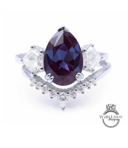 A close-up image of a silver ring with a large purple gemstone at the center, surrounded by smaller diamonds.